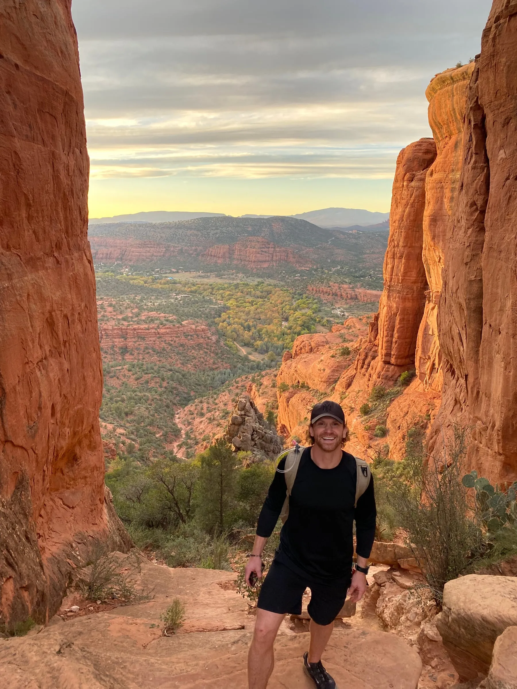 Huw Bevan on a hiking trail between red rock cliffs